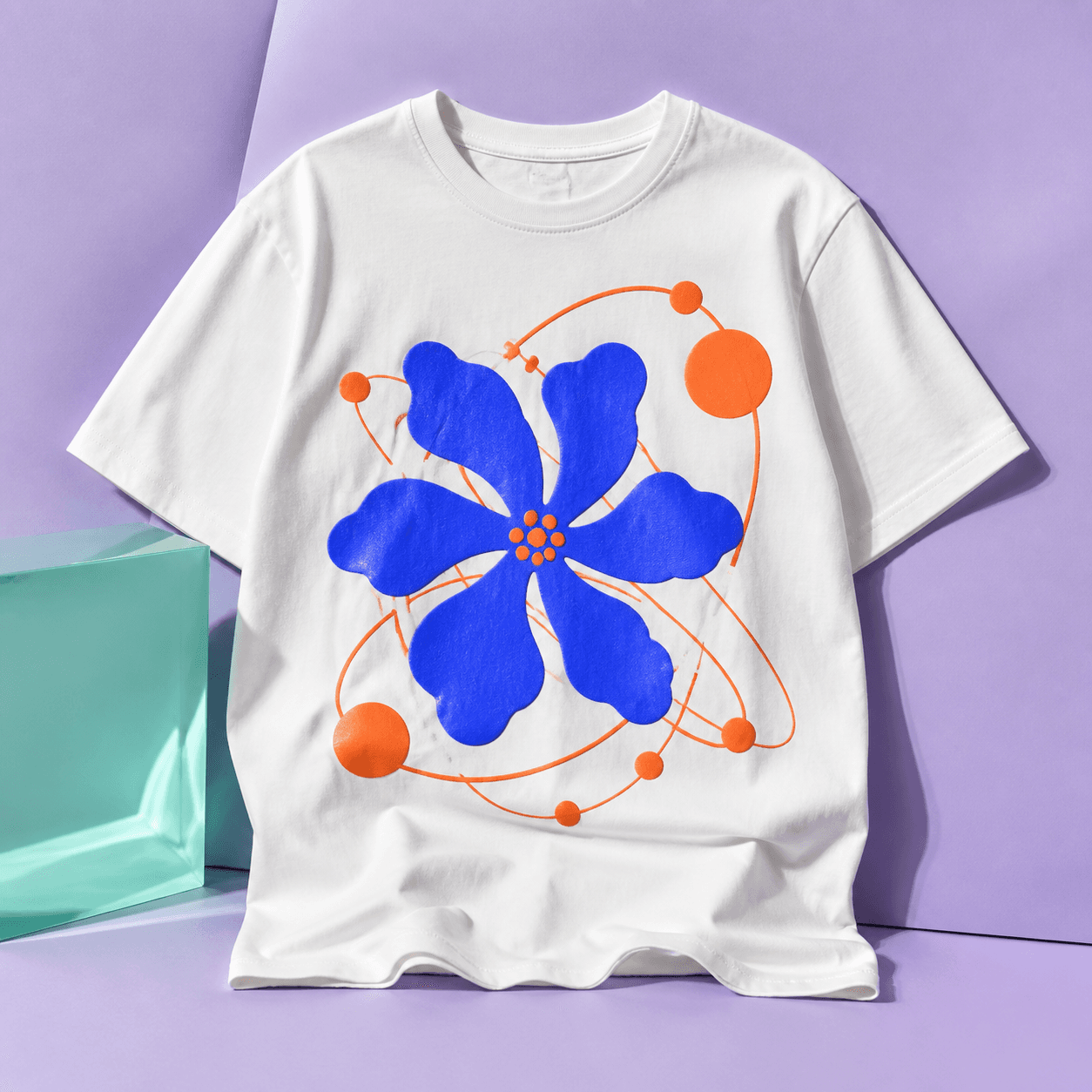 White T-shirt printed with a cobalt flower and tangerine orbit