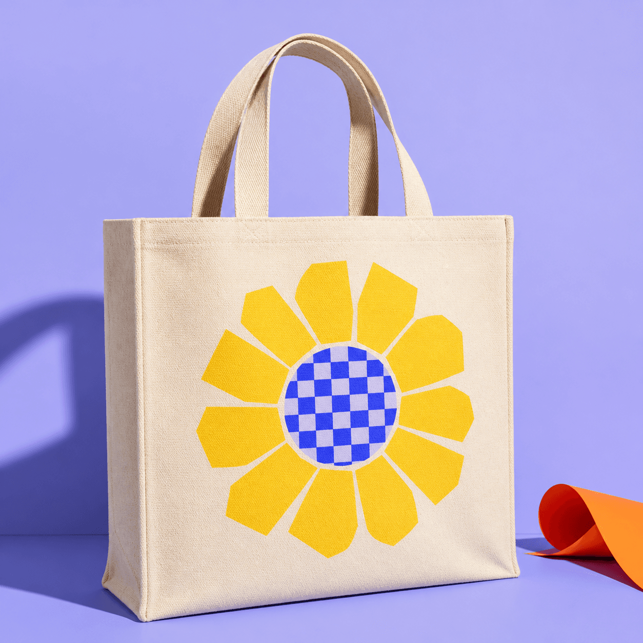 Canvas tote printed with a yellow geometric flower